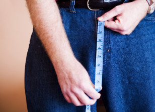 a person holding a measuring tape